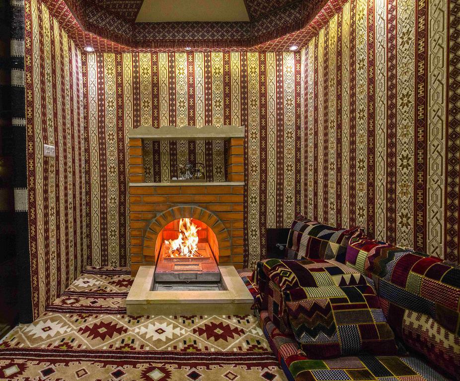 Rest Night Hotel Apartment Riadh Exterior foto A majlis with a fireplace